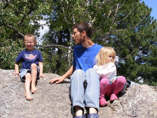 Noah, David and Sarah on rock.