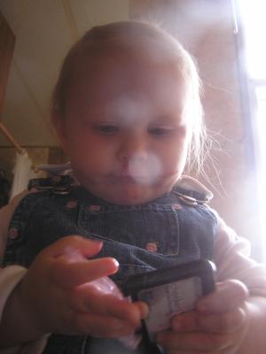 Sarah puts on some lipstick.