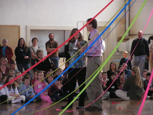 Miss Jones (Malia's teacher) receives 
and her class receive a prize for gathering the most 