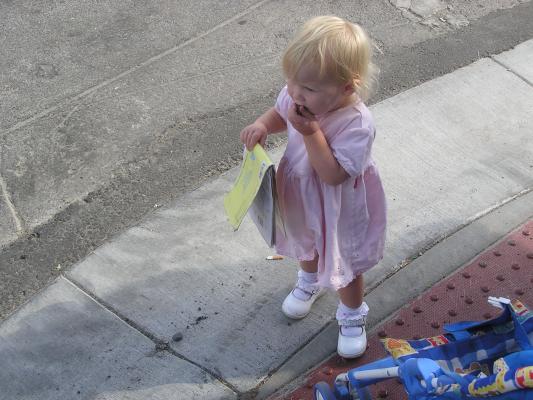 Sarah eats some candy at the parade
