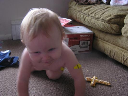 Sarah crawls on the floor.
