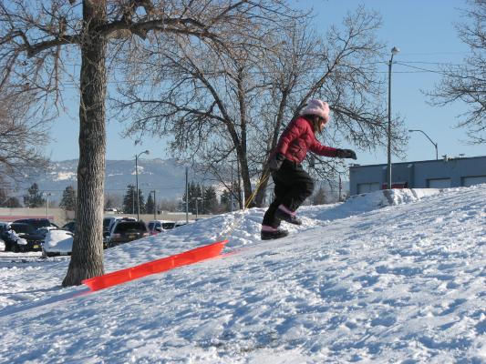 Andrea sledding.
