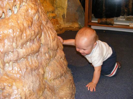 Joshua is playing in a play cave.