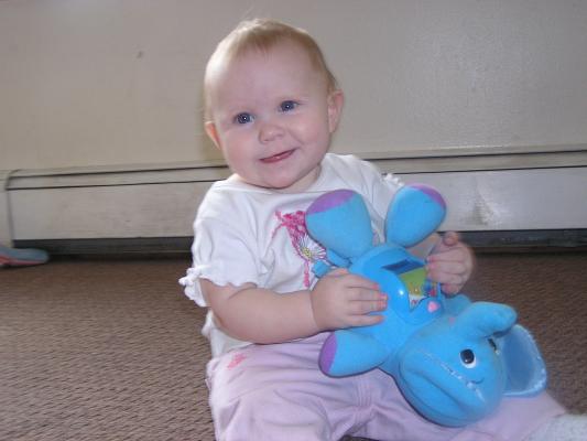Sarah plays with her new elephant.