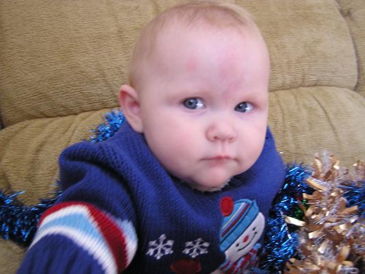 Trying to get a good Christmas photo of Sarah.
She has a new blue sweater.
