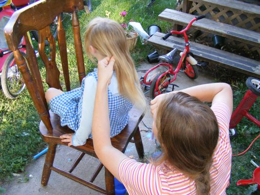 Cutting Sarah's hair too.
