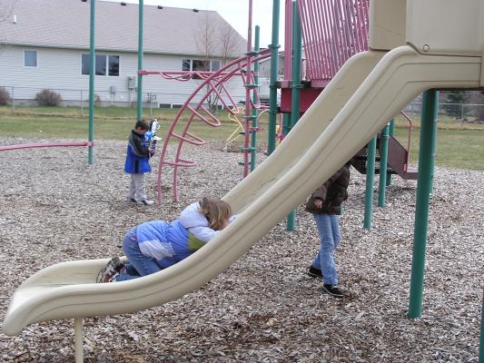 Kids play at the park before the Easter egg hunt.