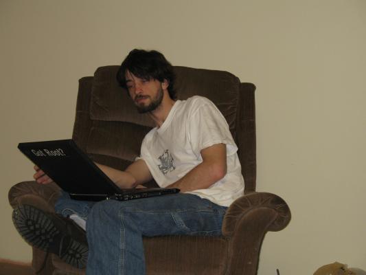 Mike plays with his computer.