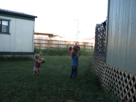 Sarah and Noah play ball.