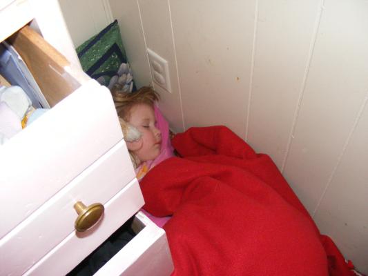 Sarah sleeping on her vent instead of her bed. 