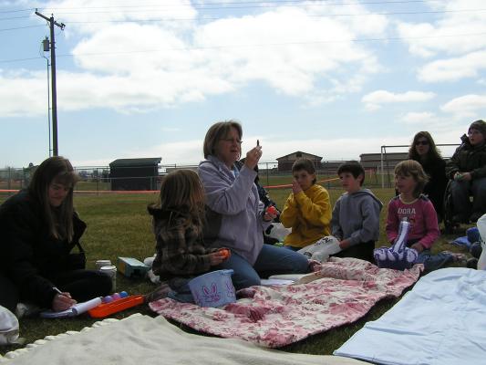 Deb tells the story of Easter to the kids using Resurrection Eggs.