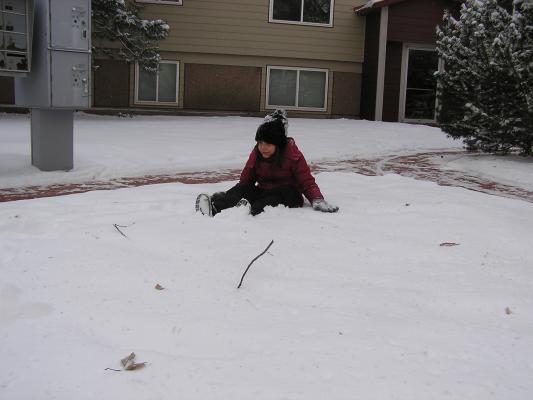 Andrea plays in the snow.