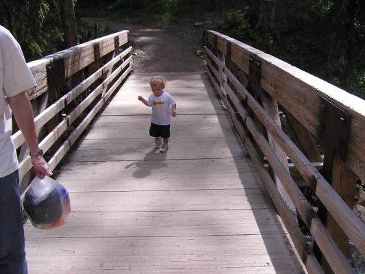 Noah crosses the bridge.