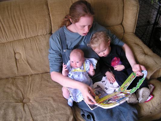 Katie reads last year's Easter book to Noah and Sarah.