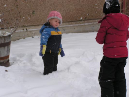 Noah and Andrea play in the snow.