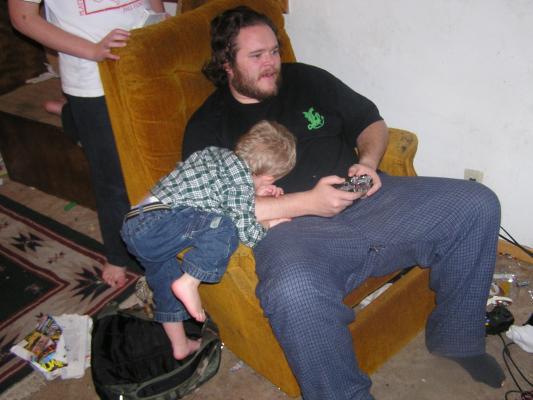 Noah fell asleep wathcing Benji play video games