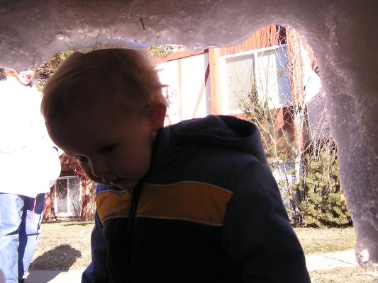 Noah bumps his head on the snow fort entrance.