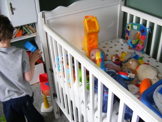Noah got all the baby toys for Joshua to play with.