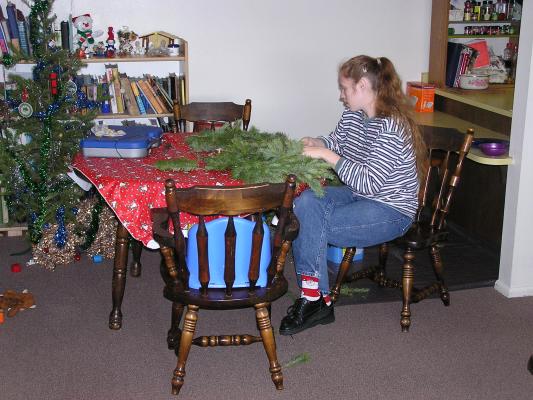 Katie makes a Christmas wreath.
