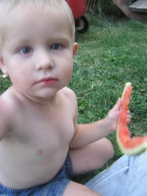 Noah eats some watermelon.