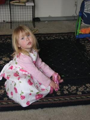Grandma Eder got Sarah a pretty dress. Grandma Cline got her a pony