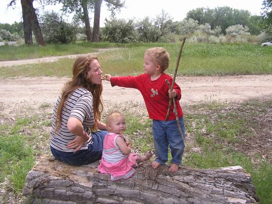Katie, Sarah and Noah play on a break from the car ride back to Montana