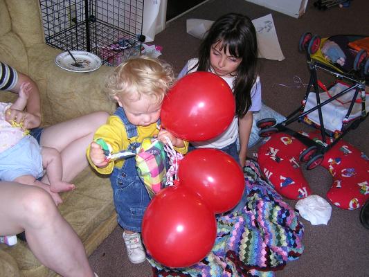 Noah opens the present.
