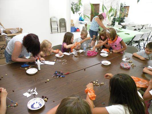Orange Aspens at the craft table.