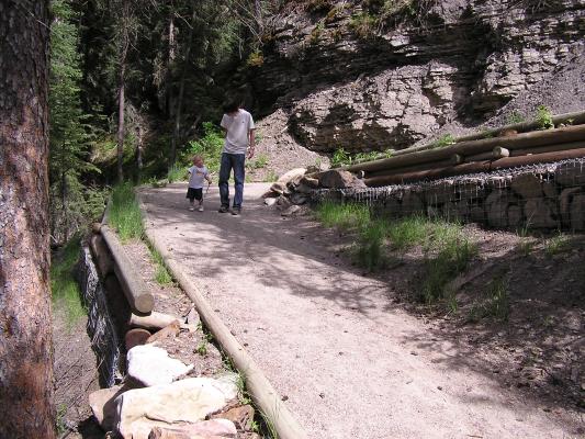 David and Noah walk down the trail.