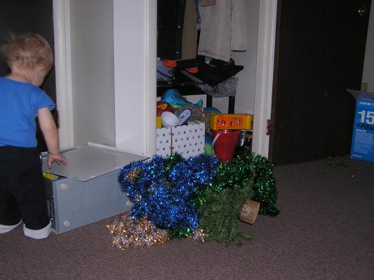 Noah leaves the tinsel for an open computer case.