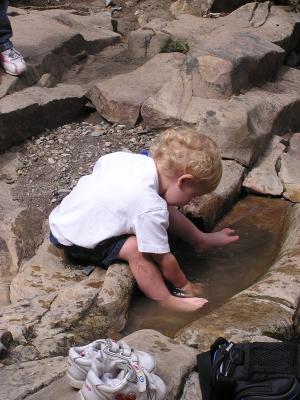 Noah really enjoyed the puddle.