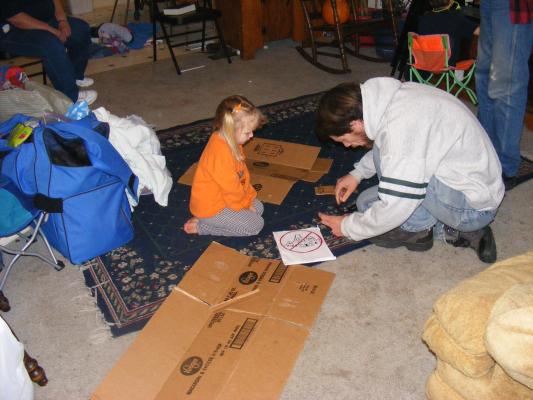 Sarah helps David make a costume.