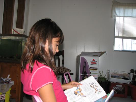 Malia reads the book Grandma brought