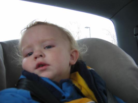 Noah in his car seat on the way to Church.