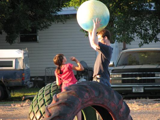 Jim teases Malia with the ball.