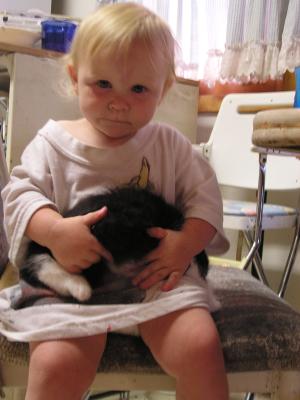 Sarah has a kitten on her lap