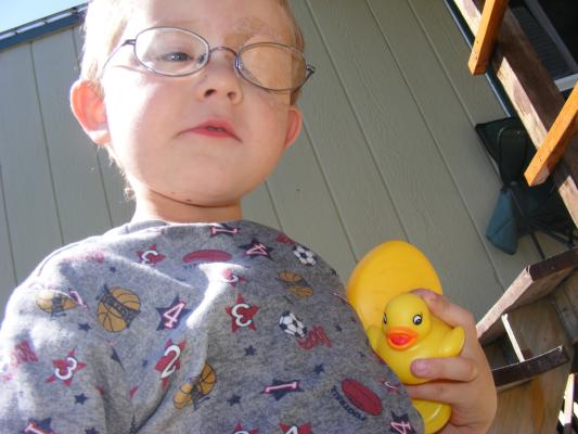 Noah plays with ducks while he patches.