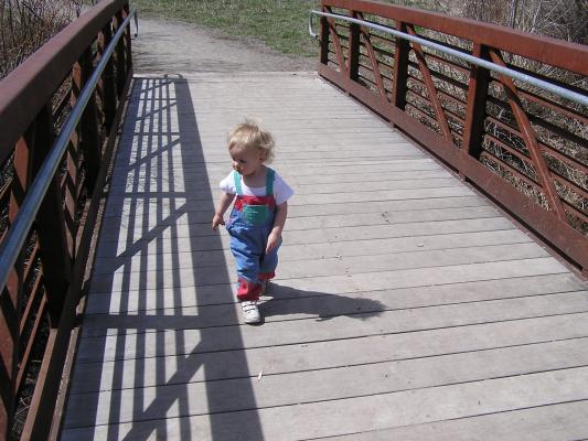 Noah walks on the bridge.