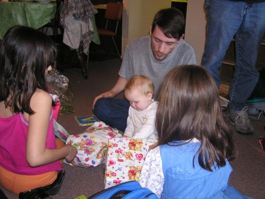 Sarah and David open presents.