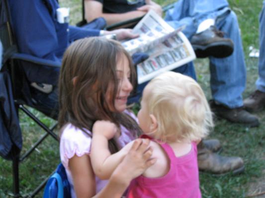 Andrea holds Sarah
