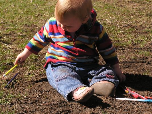 Sarah plays in the dirt.