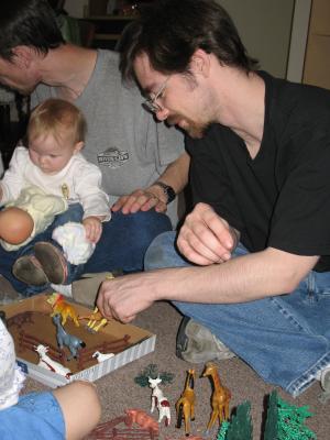 All the kids play with animals.