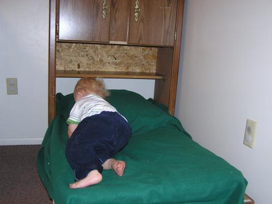 Noah checks out his new homemade toddler bed.