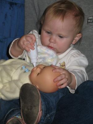 Sarah feeds her baby.