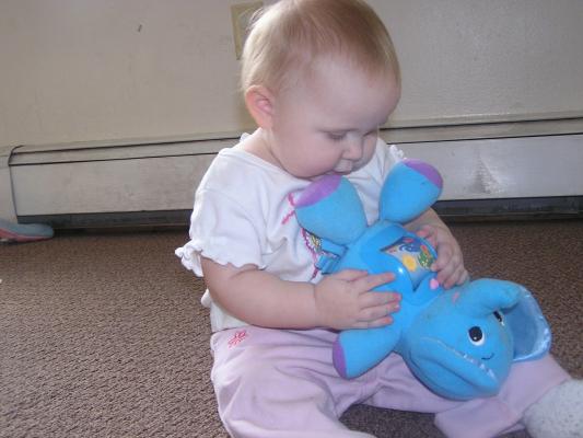 Sarah plays with her new elephant.