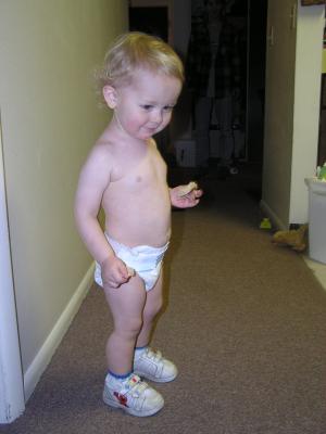 Noah in diaper and shoes.