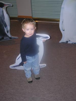 Noah with some penguins at the Museum of the Rockies.