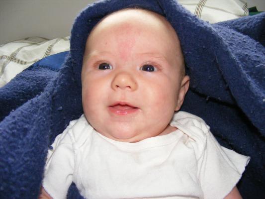 Joshua in a blue blanket.