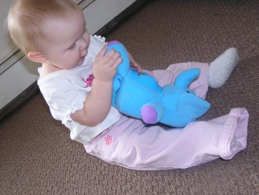 Sarah plays with her new elephant.