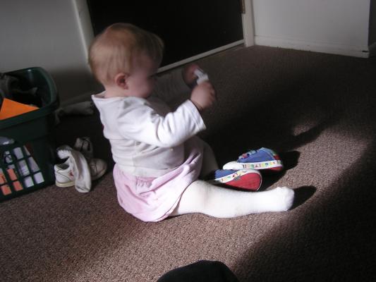 Sarah plays with shoes.